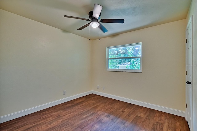 empty room with ceiling fan and hardwood / wood-style floors