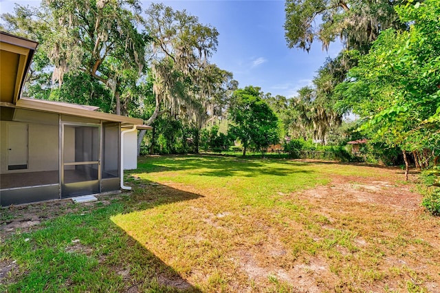 view of yard with a sunroom