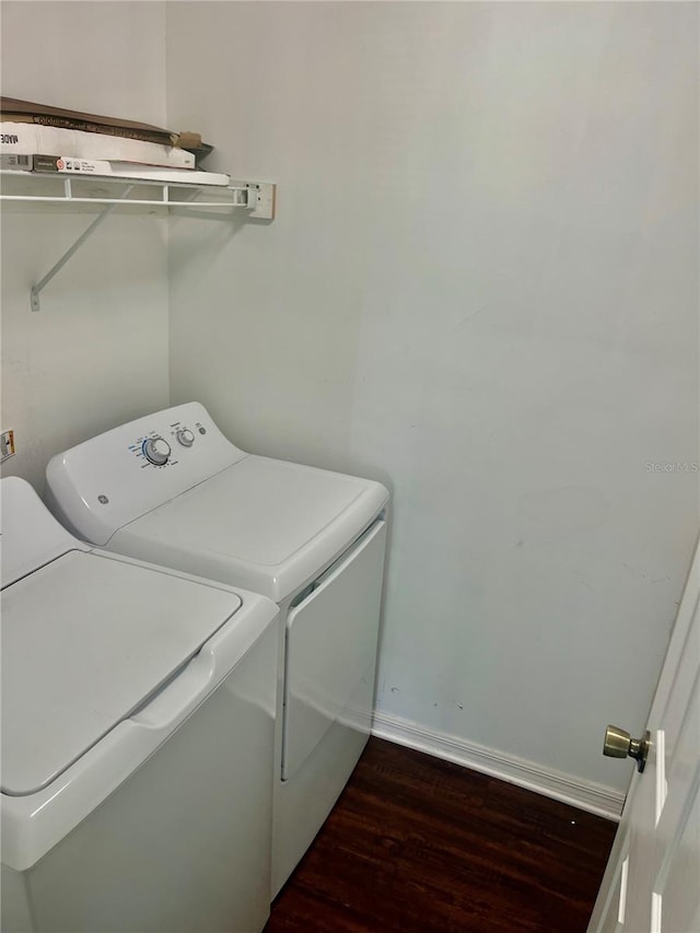 washroom featuring dark hardwood / wood-style flooring and independent washer and dryer