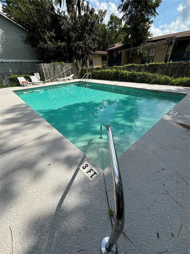2905 SW Archer Rd Unit T4028, Gainesville, FL 32608 - community pool featuring a patio area