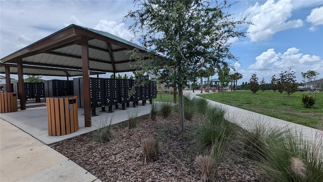 view of home's community featuring a yard, a gazebo, and mail boxes