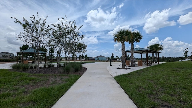 surrounding community with a gazebo and a lawn