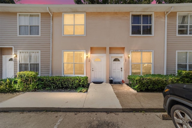 townhome / multi-family property with stucco siding