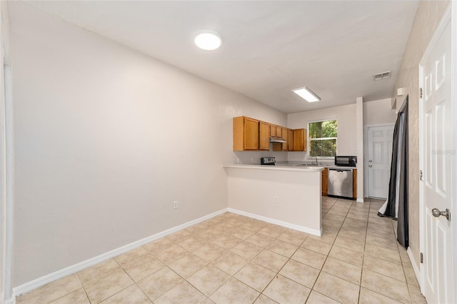 kitchen with visible vents, dishwasher, a peninsula, light countertops, and under cabinet range hood