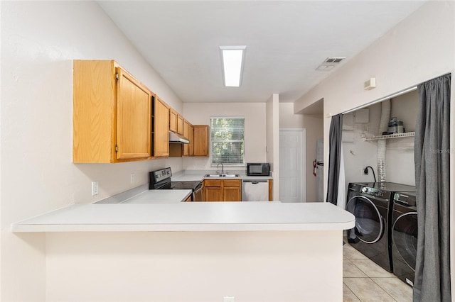 kitchen featuring washing machine and dryer, range with electric cooktop, sink, kitchen peninsula, and stainless steel dishwasher