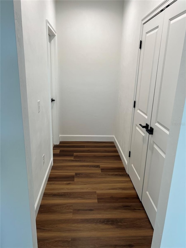 hall with dark hardwood / wood-style flooring