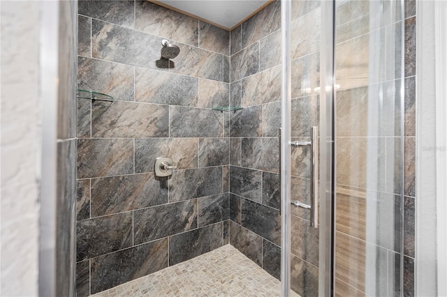 bathroom with tiled shower