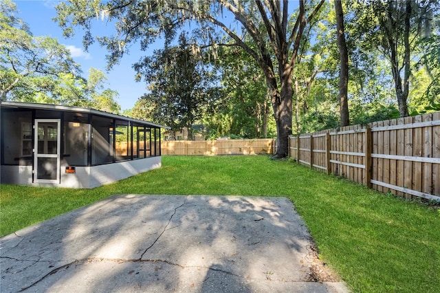 view of yard with a patio area and a sunroom