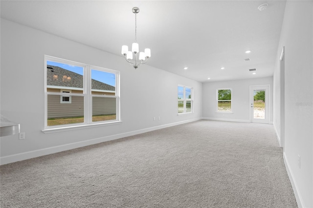 unfurnished room with recessed lighting, baseboards, carpet, and an inviting chandelier