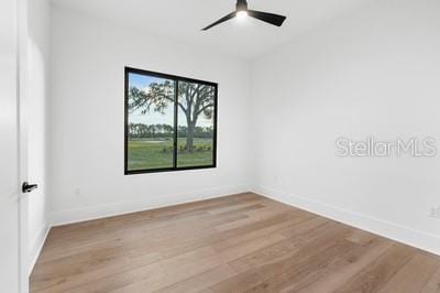 unfurnished room with ceiling fan and light hardwood / wood-style floors