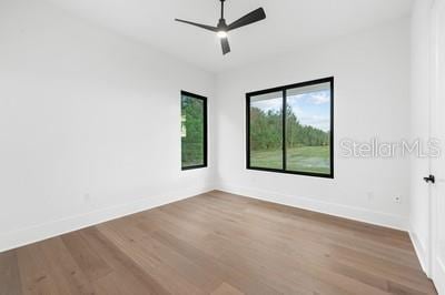 19010 SW 21st Pl, Newberry, FL 32669 - unfurnished room with hardwood / wood-style flooring and ceiling fan