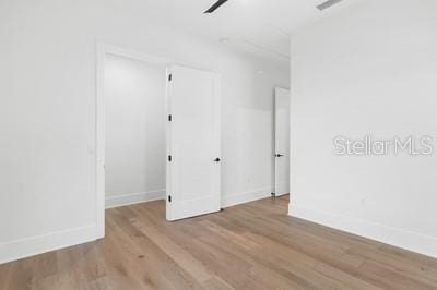 19010 SW 21st Pl, Newberry, FL 32669 - empty room with light wood-type flooring