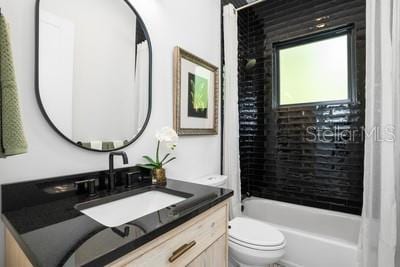 19010 SW 21st Pl, Newberry, FL 32669 - full bathroom with vanity, toilet, and tiled shower / bath combo