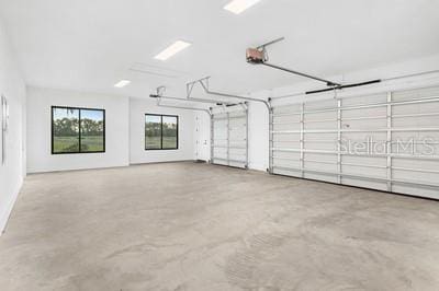 19010 SW 21st Pl, Newberry, FL 32669 - garage featuring a garage door opener