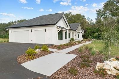 19010 SW 21st Pl, Newberry, FL 32669 - view of side of property with a garage