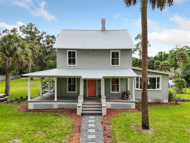 country-style home with covered porch and a front yard