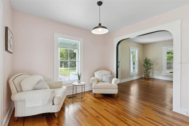 living area with hardwood / wood-style flooring