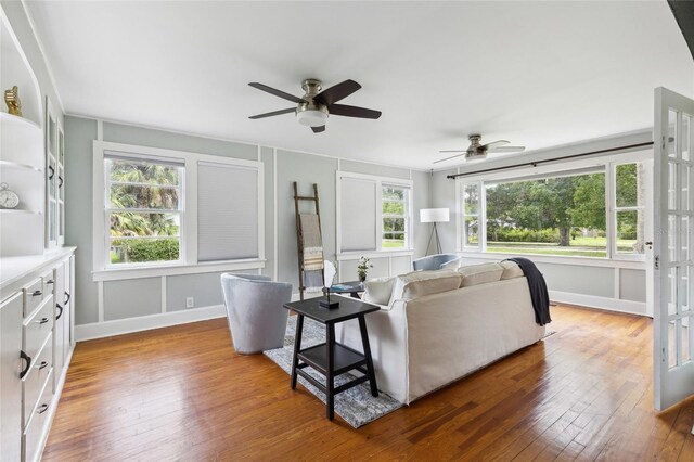 living room featuring hardwood / wood-style floors, plenty of natural light, and ceiling fan