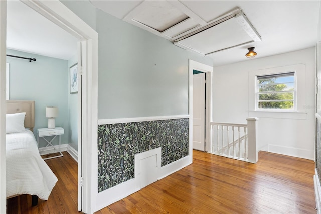 hall with wood-type flooring