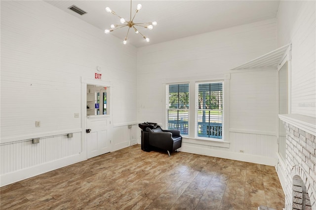 living area with an inviting chandelier