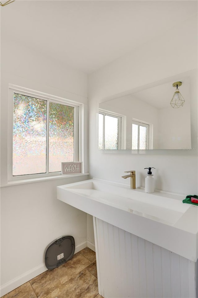 bathroom with vanity and a healthy amount of sunlight