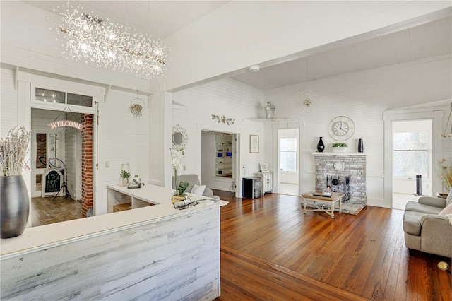 interior space featuring a fireplace and a chandelier