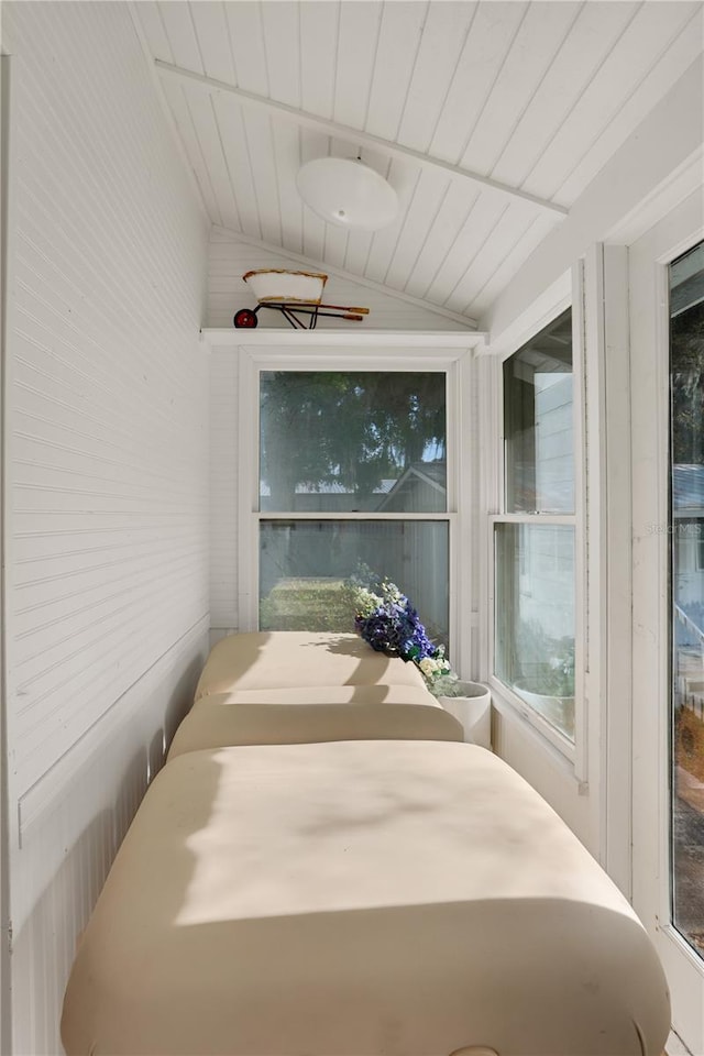 sunroom featuring wood ceiling and vaulted ceiling