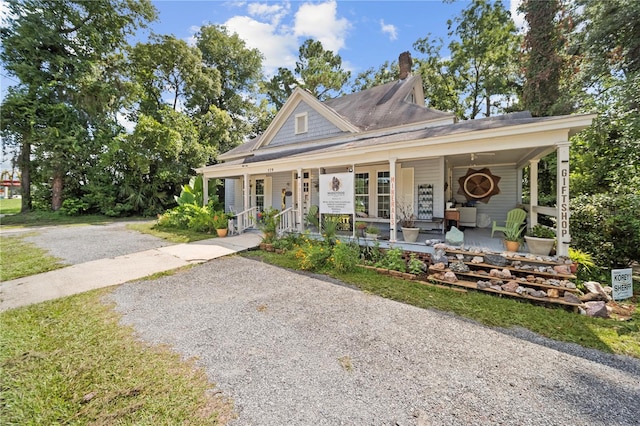 farmhouse-style home featuring a porch