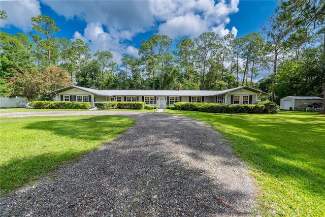 ranch-style house with a front lawn