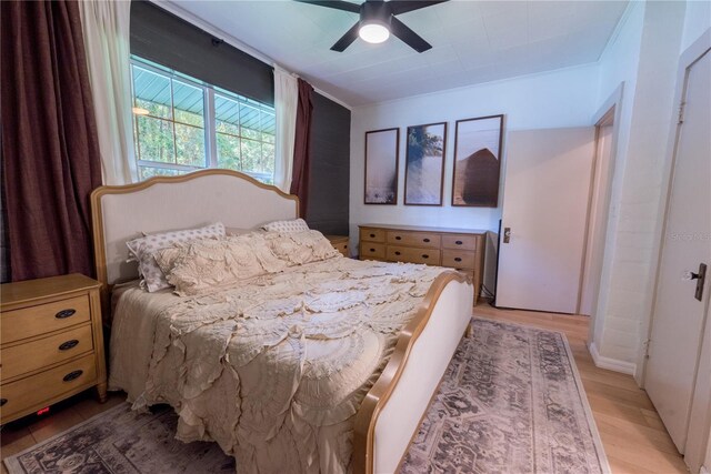 bedroom featuring ceiling fan and light wood-type flooring