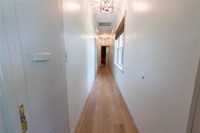 corridor with light hardwood / wood-style flooring