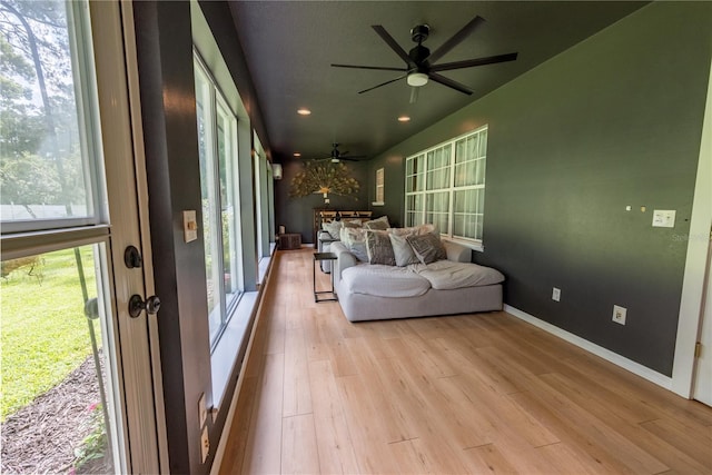 sunroom / solarium featuring a wealth of natural light and ceiling fan