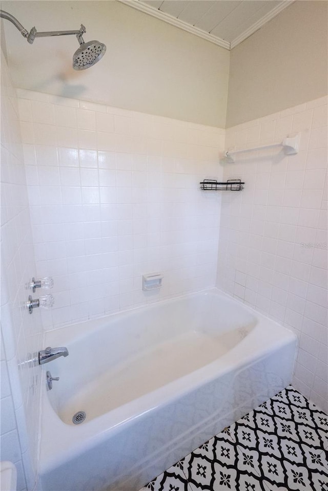 bathroom with shower / washtub combination, tile patterned floors, and crown molding