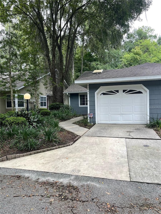 single story home featuring a garage