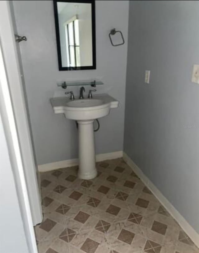 bathroom with tile patterned flooring