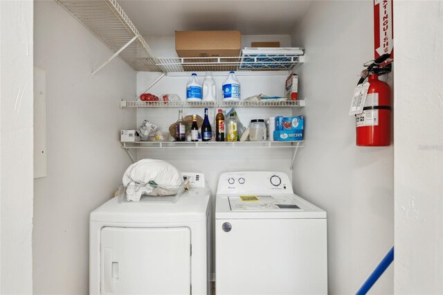 washroom with washing machine and dryer