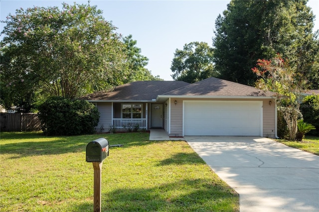 ranch-style house with a garage and a front lawn