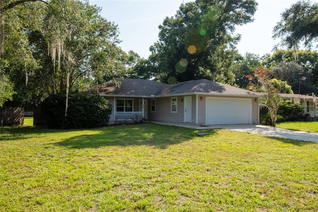 ranch-style home with a garage and a front yard