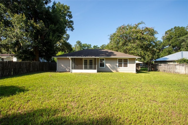 back of house with a yard