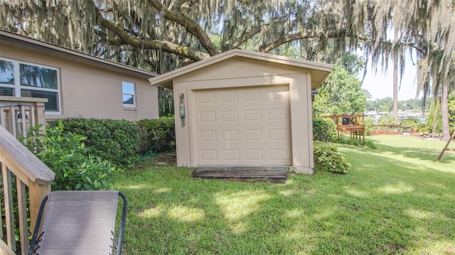 garage featuring a lawn