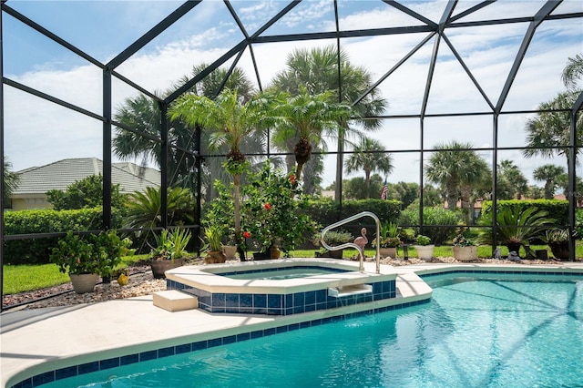 view of swimming pool with a lanai and an in ground hot tub