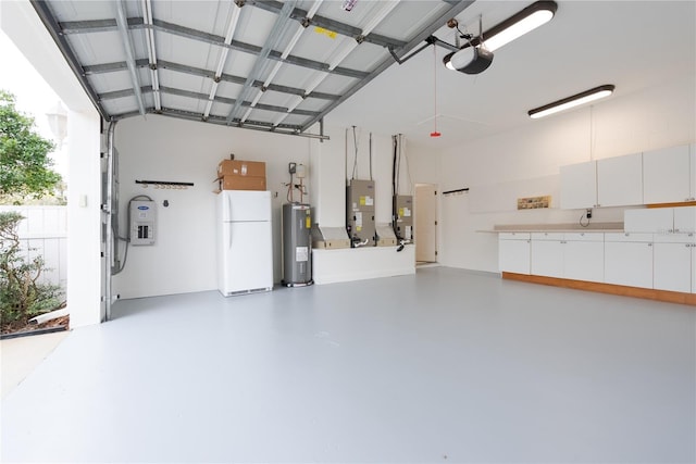 garage with white refrigerator, electric water heater, a garage door opener, and heating unit