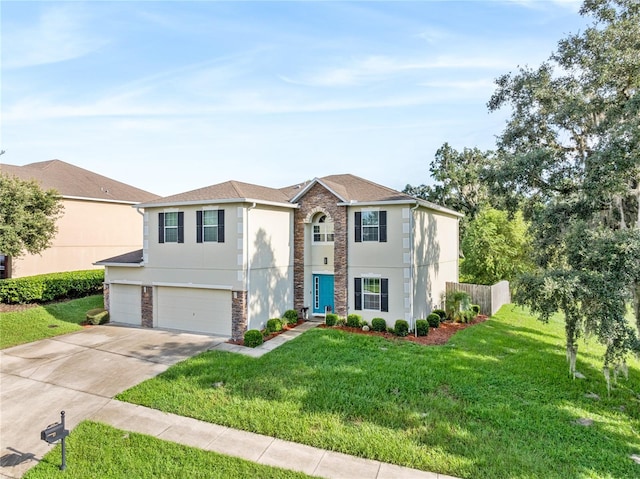 view of front facade with a front yard and a garage