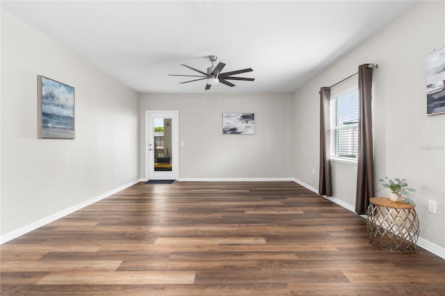 empty room with ceiling fan and wood-type flooring