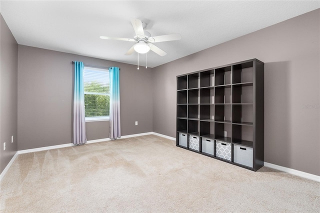 carpeted empty room with ceiling fan