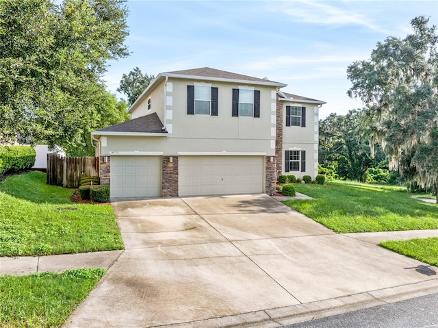 view of front of home featuring a front lawn and a garage