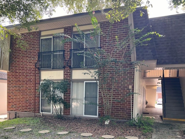 exterior space featuring brick siding