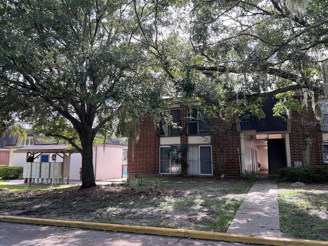 view of front of home with brick siding