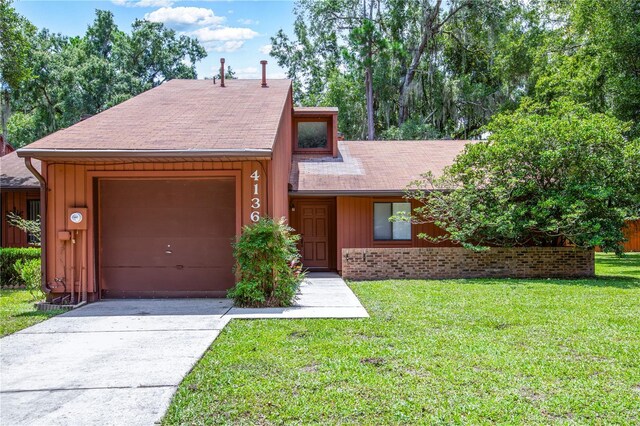 single story home with a front lawn and a garage