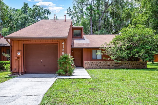 view of front of home featuring brick siding, a front lawn, board and batten siding, and concrete driveway